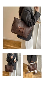 Macro shot of dark brown PU leather tote featuring vintage letter towel embroidery
