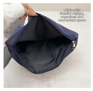 Deep blue fabric tote interior view showing large capacity and smooth zipper closure