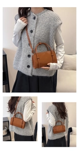 Detail of caramel leather bag showing fashion embossing and adjustable shoulder strap