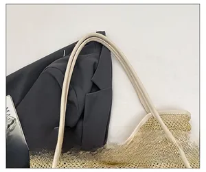 Detail of premium leather shoulder straps and woven mesh texture on the yellow tote bag