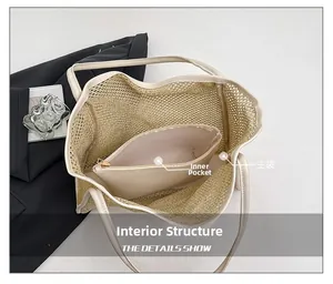 Detail view of woven tote bag showing spacious main compartment and inner zipper pouch