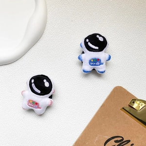 Cute plush astronaut phone socket featuring detailed embroidery and a pop-up grip design