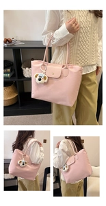 Close-up of pink nylon tote bag showing the water-resistant fabric and cute dog charm