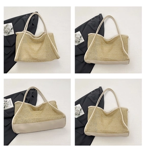 Detail of woven straw tote bag featuring mesh texture and reinforced leather straps