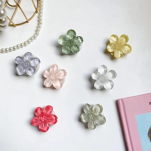Macro shot of assorted colorful floral phone socket grips with translucent resin finish