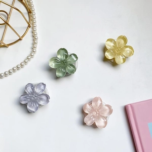 Detailed view of four colorful floral resin phone sockets with pearlescent finish