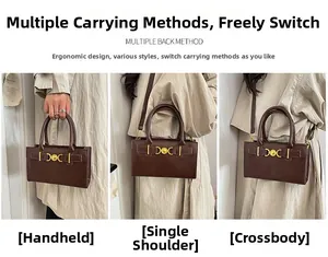 Deep brown tote bag with heart hardware showing handheld, shoulder and crossbody styles