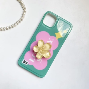 Green phone case with pink cloud pattern and golden 3D flower pop-up socket stand