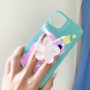 Detail of mint green phone case featuring a pink floral pop socket and love graphic design