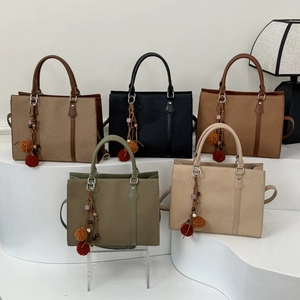Minimalist woven faux leather handbag set in five colors with decorative tassel charms