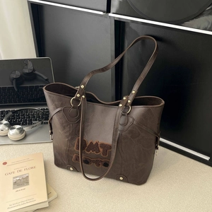 Brown large capacity tote bag with DAT plush patch on minimalist wrinkled faux leather