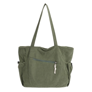 Dark green corduroy tote bag with front zipper pocket and side pockets on white background