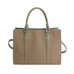 Retro khaki canvas and green leather tote bag with dual handles and crossbody strap