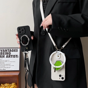 Detail showing iPhone cases with metal ring stands and detachable crossbody leather straps