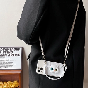 Detail of white cross-body iPhone case with a 3D cat decoration and leather strap