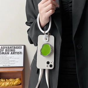 White iPhone case with green gem stand and round silicone hand ring with crossbody strap