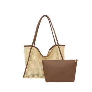 Large beige woven straw tote bag with brown leather handles and matching inner pouch set