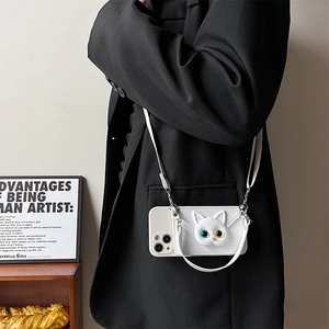 Detail of white 3D cat head phone case with mismatched eyes and crossbody strap