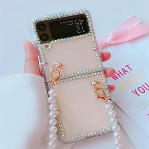 Clear diamond-studded folding case for Samsung Z Flip with pearl handle strap