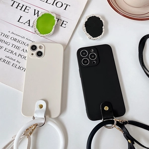 Minimalist matte iPhone case with silicone wrist strap and adjustable crossbody lanyard