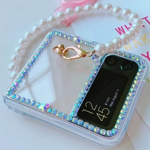 Close-up of clear folding case for Z Flip with rhinestones, purple butterfly, and pearl chain