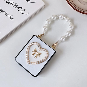 Elegant Z Flip case with pearl heart, golden bow, and luxury pearl handle strap