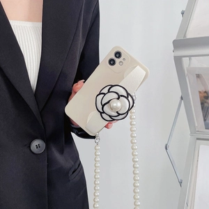 iPhone 16 Pro Max case with camellia wristband and long pearl crossbody chain strap