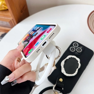 Detail of iPhone case with large ring handle and precise bottom cutouts for charging port