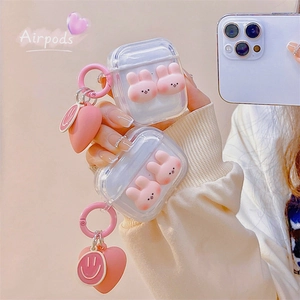 Pink 3D bunny transparent AirPods Pro case with heart and smiley face pendant charms