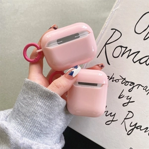 Pink rabbit silicone case for AirPods with metal ring holder being held by hand
