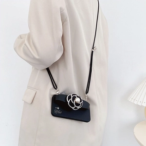 Crossbody iPhone case with silver camellia floral charm and elegant pearl accent