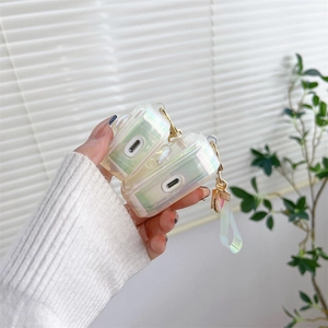 Detail of holographic TPU AirPods case featuring a gradient laser finish and wrist strap