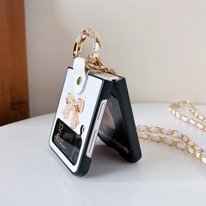 Detail of Galaxy Z Flip phone case with pearl bow, gold ring, and crossbody chain strap
