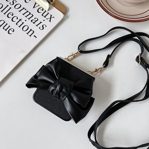 Close-up of black crossbody bag with large bow and gold metal hooks for Samsung ZFlip6