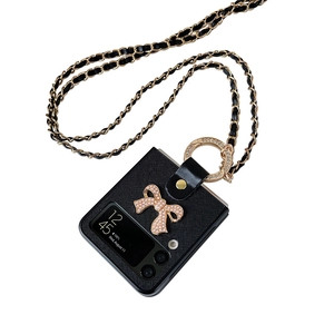 Z Flip 6 case with pearl bow decor and black crossbody chain strap in leather