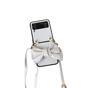 White Samsung Galaxy Z Flip folding phone case with large bow and crossbody strap