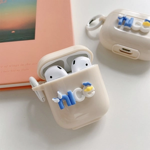 Detail of creamy white AirPods case with 3D blue nice logo and portable hook side view
