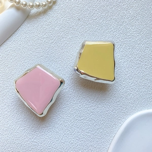 Detail of square plated phone grip with pink and yellow glossy enamel finish