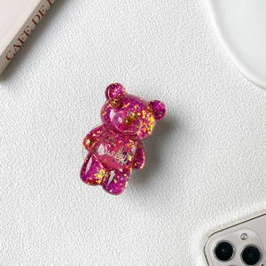 Detail of rose red translucent bear phone grip with sparkling sequins and Sweet text