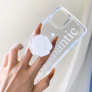 Detail view of transparent iPhone case with 3D white rose socket and Romantic text