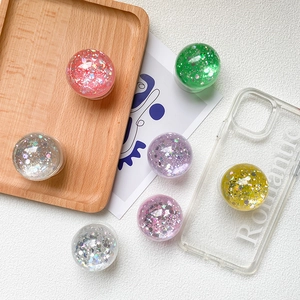 Sparkly glitter crystal ball retractable phone grip stand in various colors for smartphones