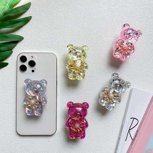 Glitter bear phone socket grip in multiple colors with gold flower and pearl accents