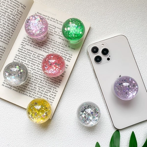 Sparkly crystal glitter phone socket grip with colorful sequins on white phone case