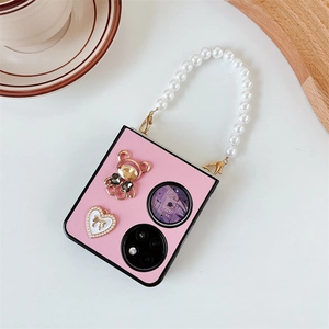 Pink textured folding phone case with pearl handle and bear heart pendant charms
