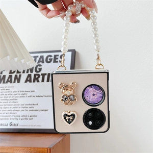 Detail of beige folding phone case with pearl chain, teddy bear and heart bow decor