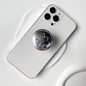 Metallic silver bear phone socket stand on white smartphone with glossy plating finish