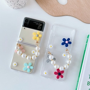 Clear floral Z Flip case with white pearl handle strap and 3D daisy flower decorations