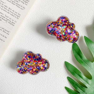 Detailed view of cloud-shaped bear phone holders with colorful glitter inside