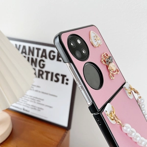 Pink lychee leather case for foldable phone featuring pearl chain and gold heart charm