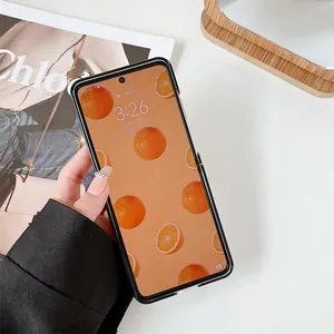 Detail of sleek black folding phone case held by model with minimalist artistic background